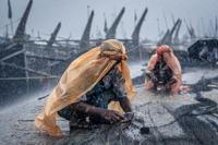 Busy fishermen in rough weather